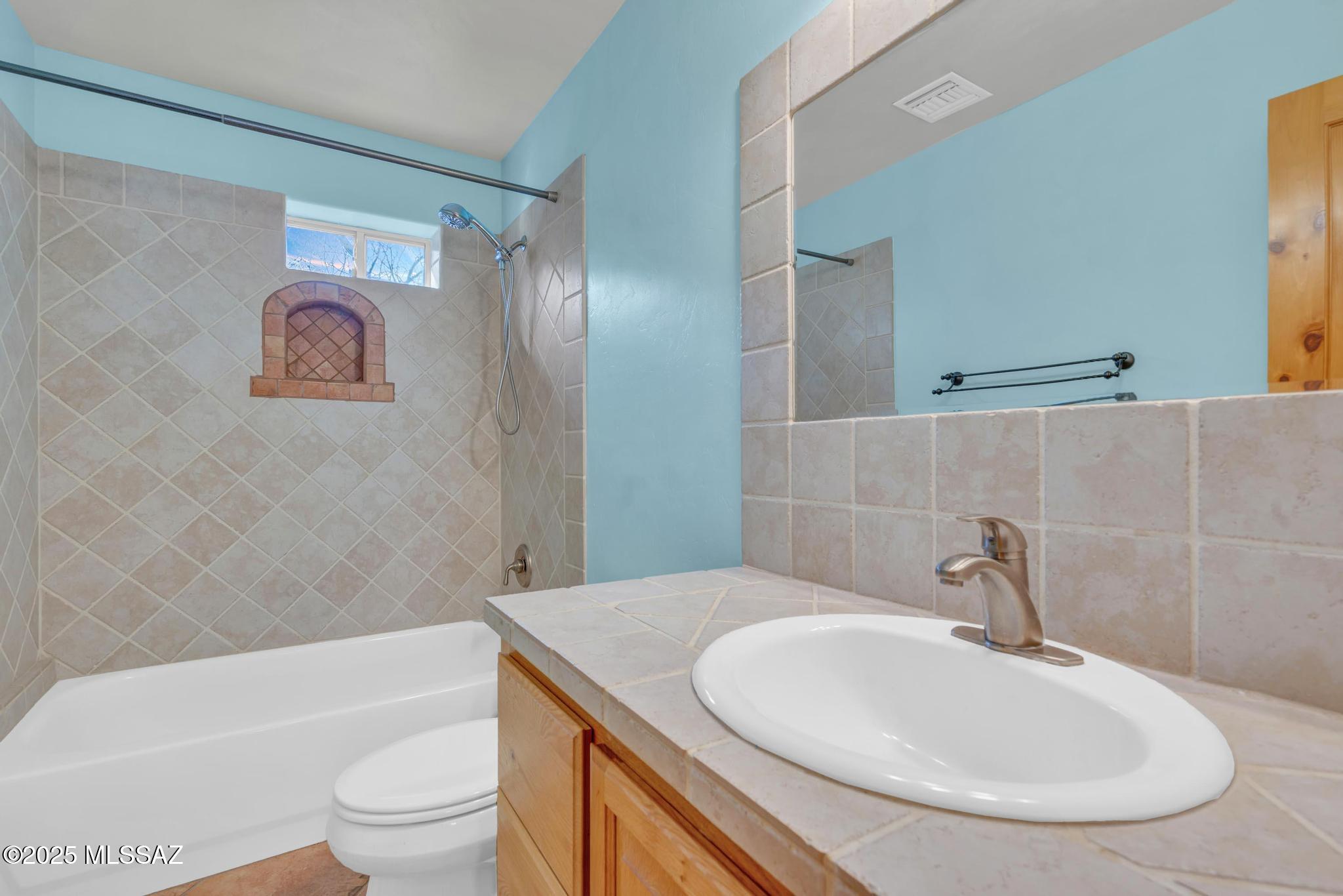 1794 Oahu Court Rio Rico, AZ 85648 - Photo 35 of 48 a bathroom with a toilet sink and bathtub