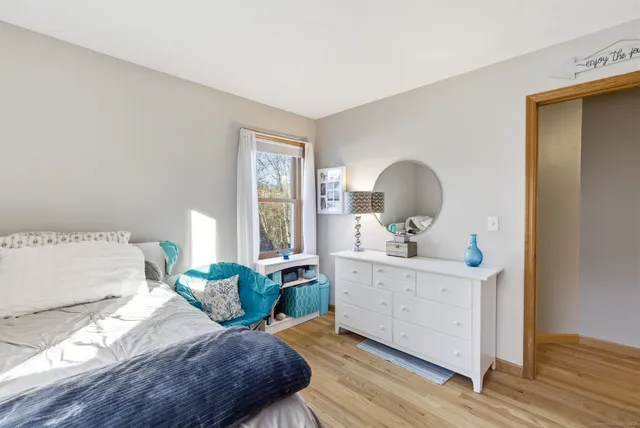 a bedroom with a bed and a dresser