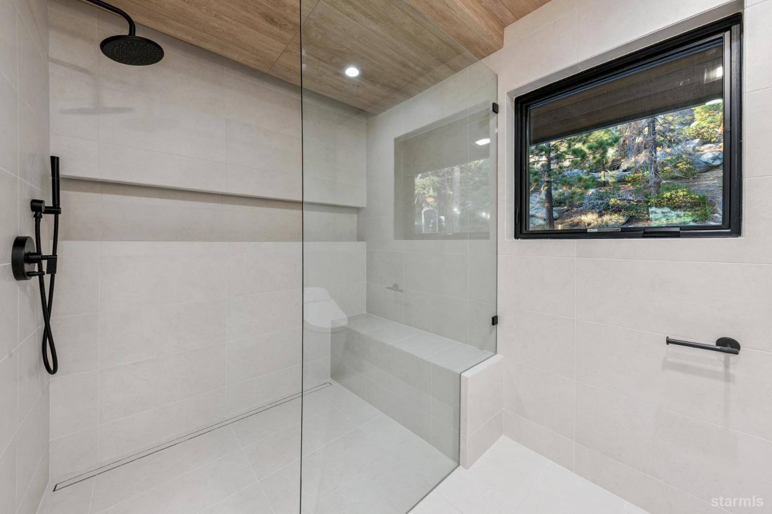 3960 Saddle Road South Lake Tahoe, CA 96150 - Photo 27 of 40 a bathroom with a bathtub and a shower