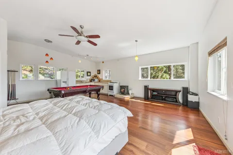a bedroom with a bed and a chandelier