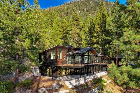 a view of a house with roof deck and sitting area