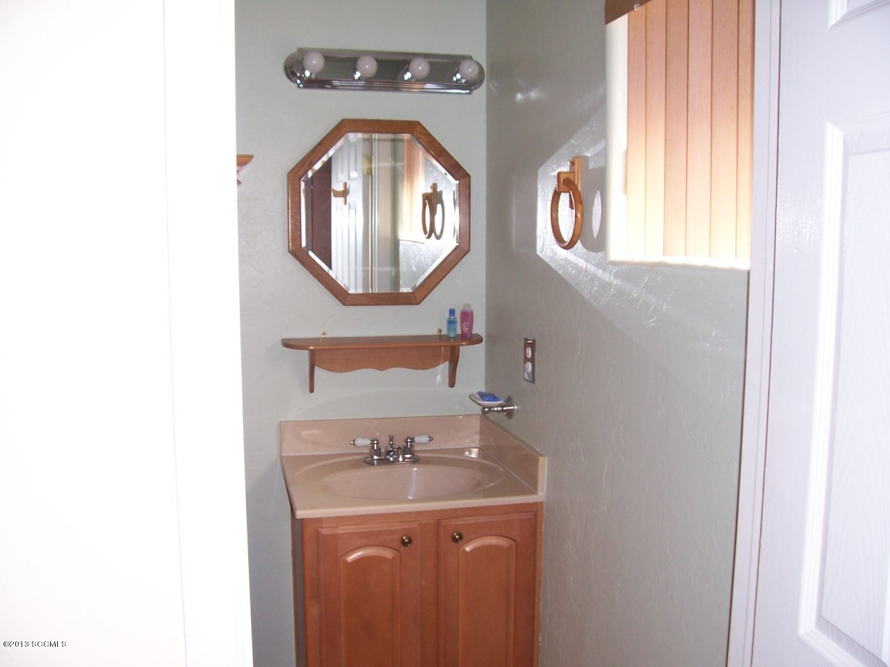 791 Camino Loma Rio Rico, AZ 85648 - Photo 12 of 13 a bathroom with a sink and a mirror
