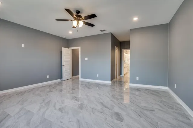 a bathroom with a glass shower door