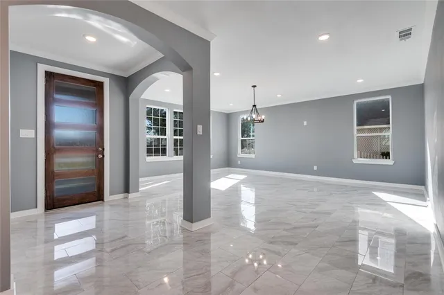 a view of an empty room and a window
