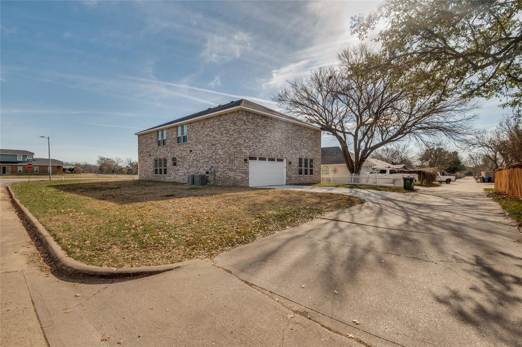301 South Stewart Avenue Lancaster, TX 75146 - Photo 32 of 35 a view of road with large trees