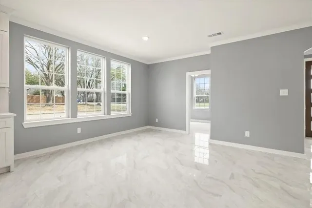 a kitchen with kitchen island a sink stainless steel appliances and cabinets