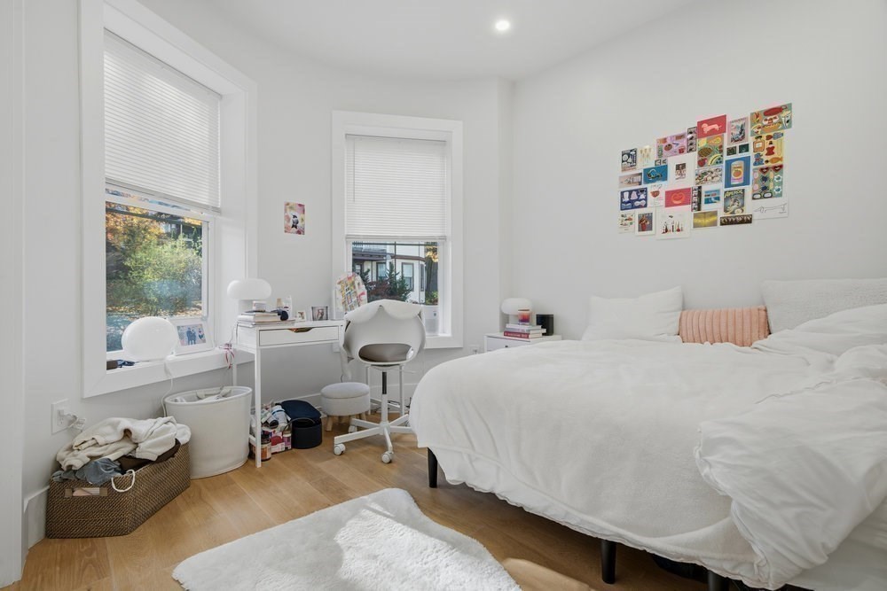 97 Hillside Street Boston, MA 02120 - Photo 11 of 41 a bedroom with a bed and wooden floor