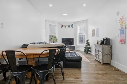 a view of a dining room with furniture and a table