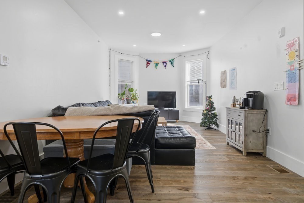 97 Hillside Street Boston, MA 02120 - Photo 19 of 41 a view of a dining room with furniture and a table