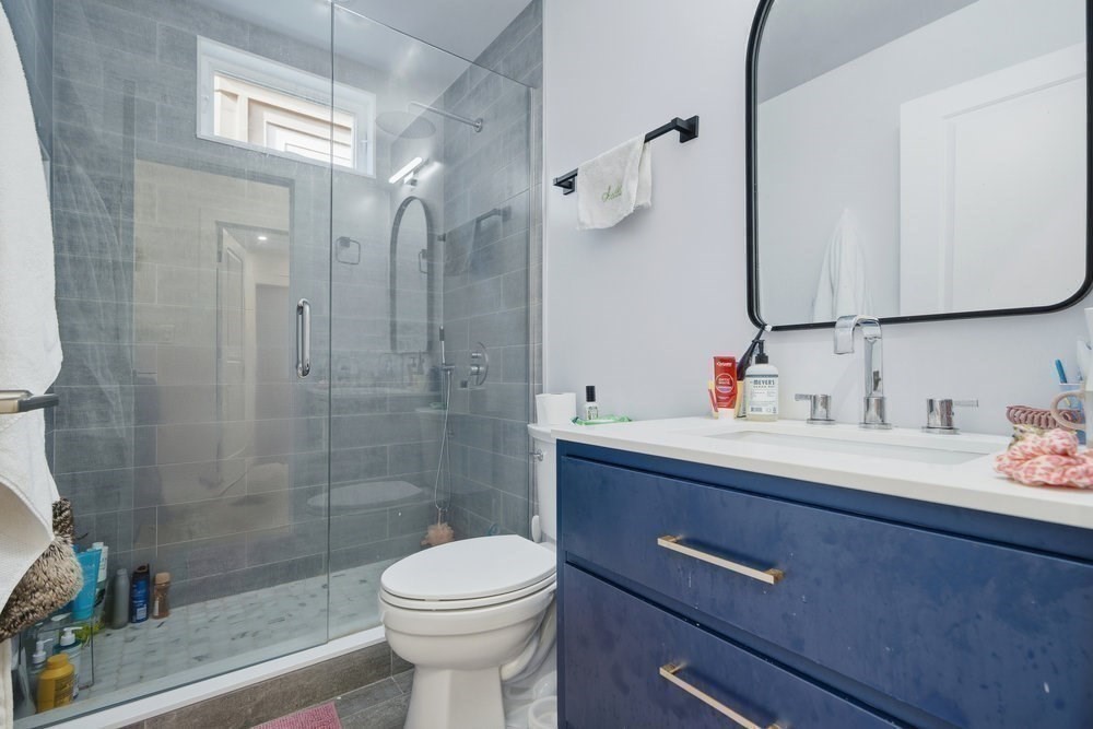 97 Hillside Street Boston, MA 02120 - Photo 20 of 41 a bathroom with a sink a toilet and shower