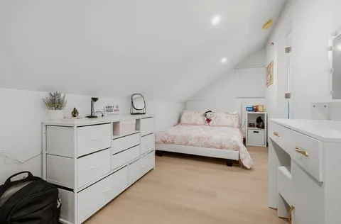 a utility room with cabinets and washer