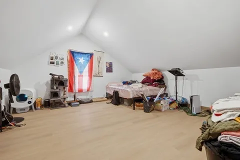 a bedroom with furniture and a gym equipment