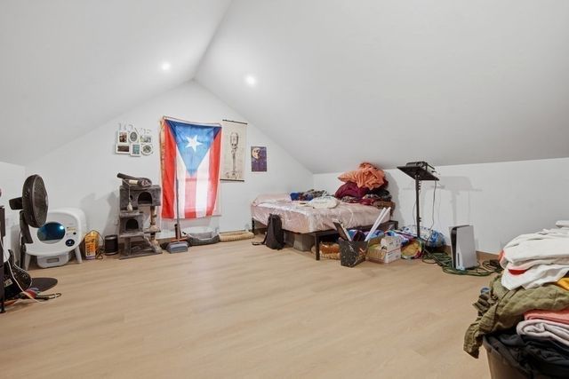 a bedroom with furniture and a gym equipment