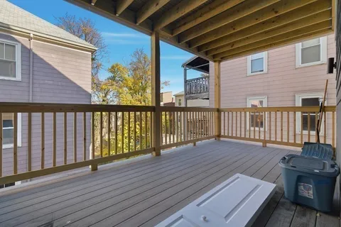 a view of deck with wooden floor and outdoor seating