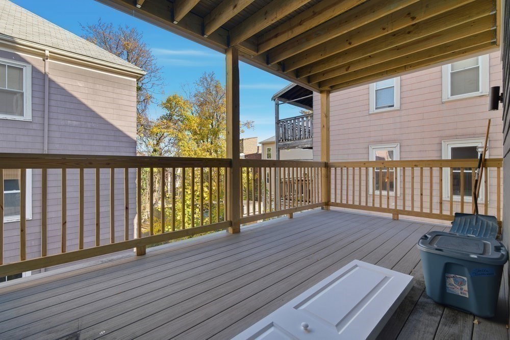 97 Hillside Street Boston, MA 02120 - Photo 38 of 41 a view of deck with wooden floor and outdoor seating