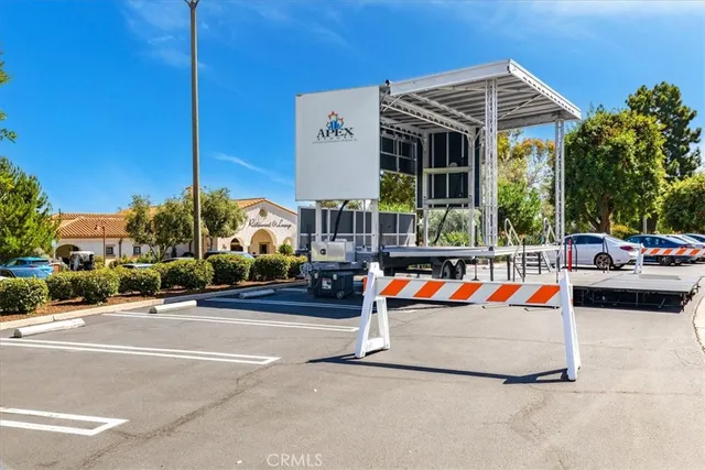 a balcony view with table and chairs potted plants