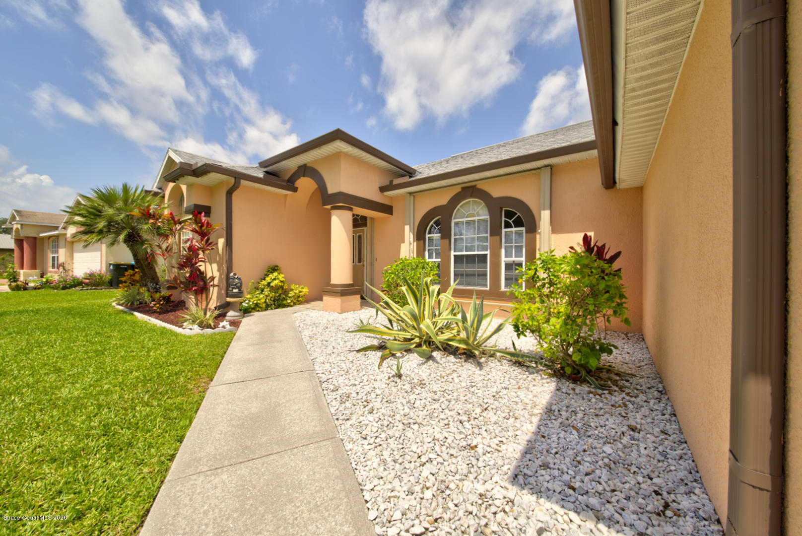 581 Raleigh Road Southeast Palm Bay, FL 32909 - Photo 1 of 60 walkway to front entry
