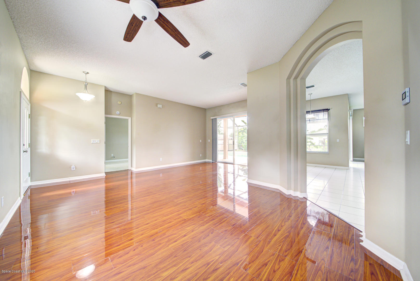 581 Raleigh Road Southeast Palm Bay, FL 32909 - Photo 26 of 60 dining room with laminate floor