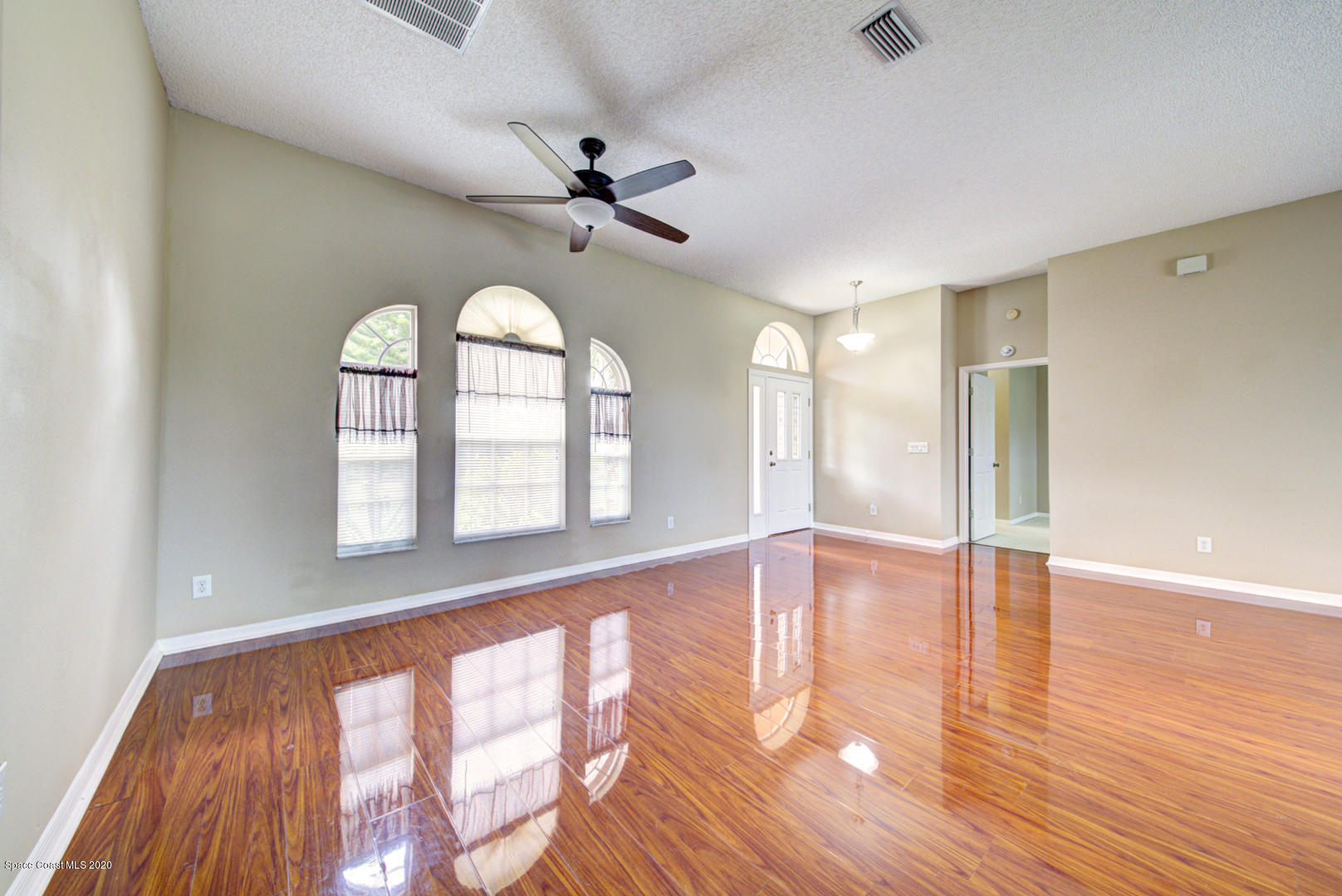 581 Raleigh Road Southeast Palm Bay, FL 32909 - Photo 27 of 60 dining room open to foyer