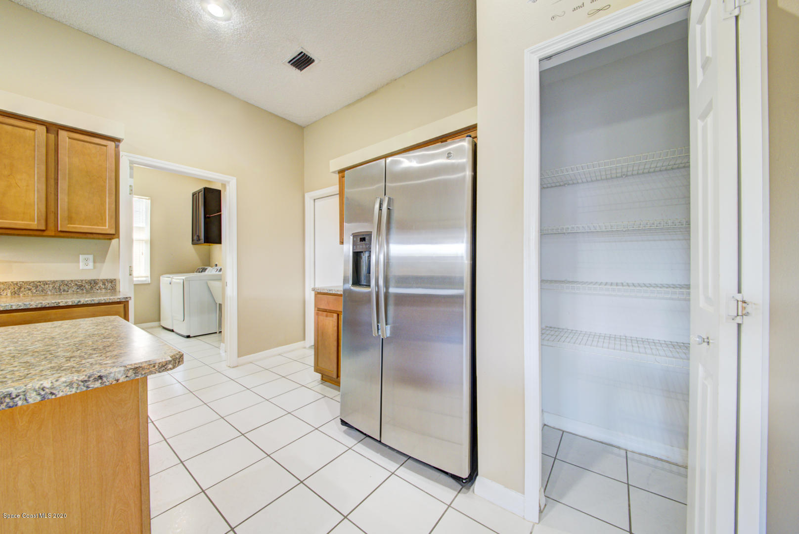 581 Raleigh Road Southeast Palm Bay, FL 32909 - Photo 36 of 60 kitchen with pantry