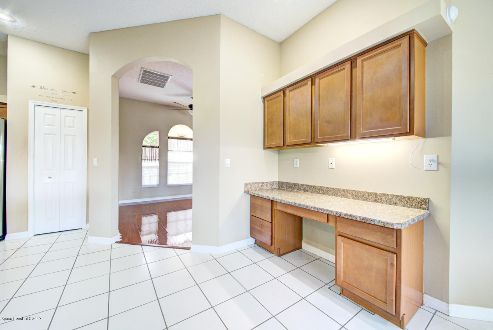 581 Raleigh Road Southeast Palm Bay, FL 32909 - Photo 37 of 60 kitchen with built in desk