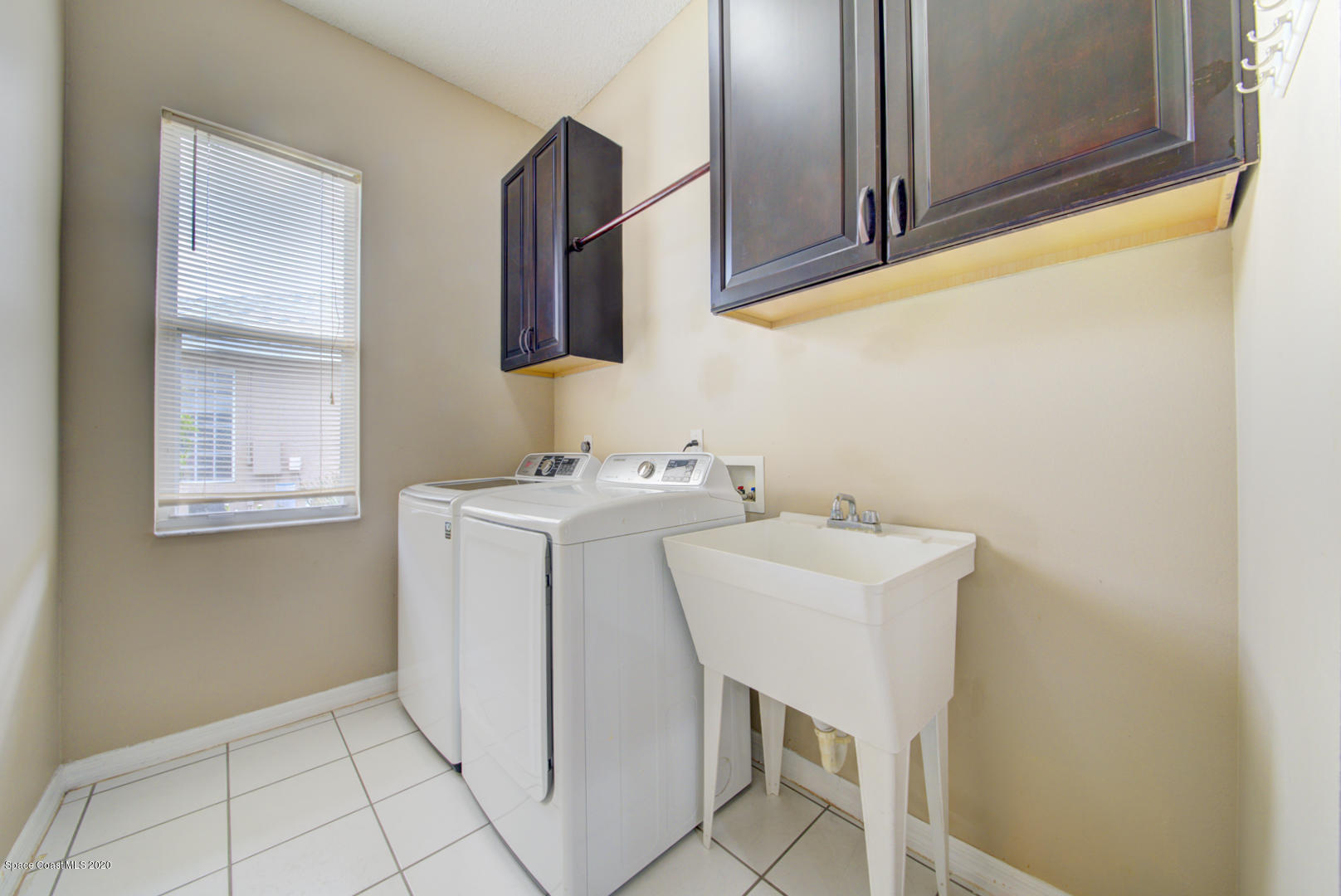 581 Raleigh Road Southeast Palm Bay, FL 32909 - Photo 39 of 60 laundry room off of kitchen