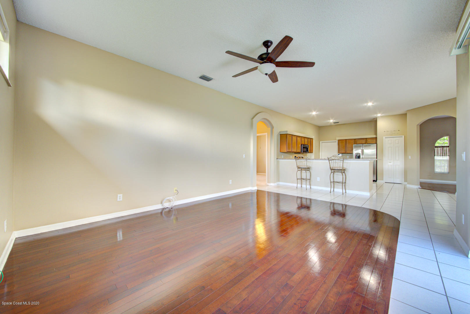 581 Raleigh Road Southeast Palm Bay, FL 32909 - Photo 41 of 60 family room open to kitchen