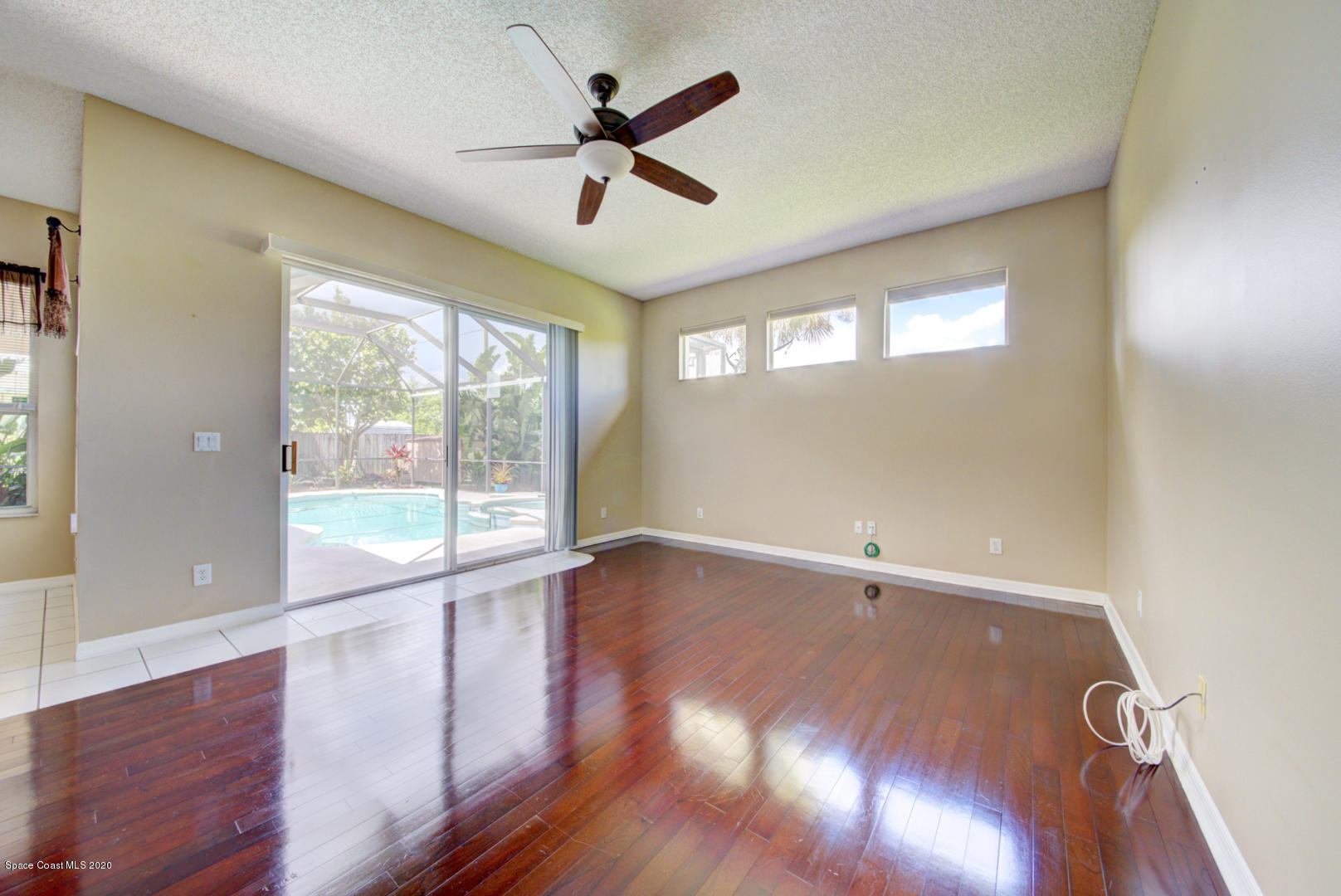 581 Raleigh Road Southeast Palm Bay, FL 32909 - Photo 42 of 60 family room with pool view