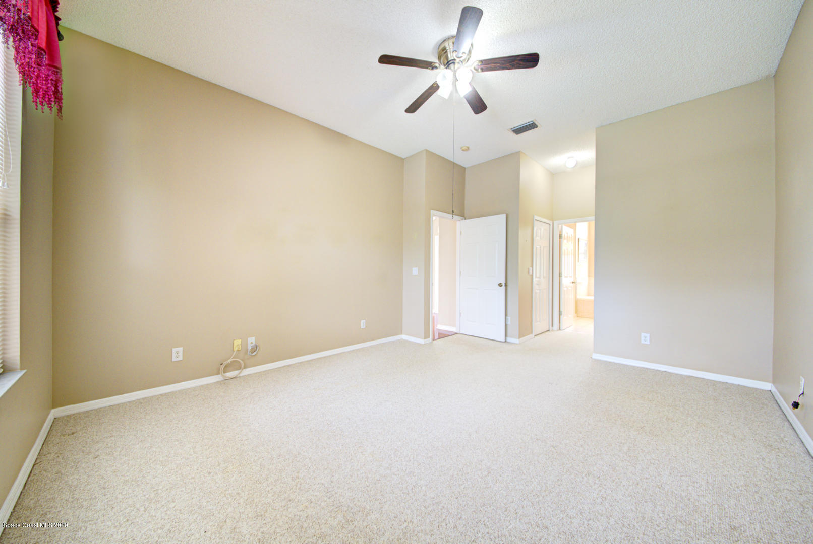 581 Raleigh Road Southeast Palm Bay, FL 32909 - Photo 43 of 60 master bedroom with ensuite