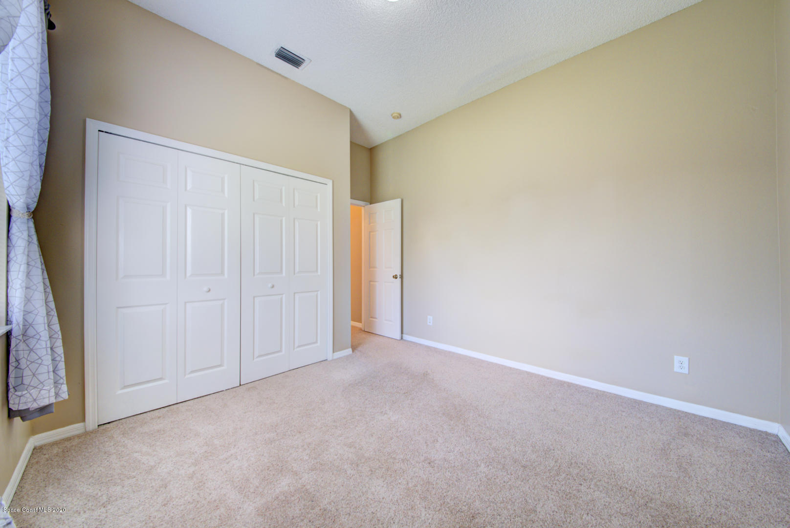 581 Raleigh Road Southeast Palm Bay, FL 32909 - Photo 54 of 60 bedroom 2 with carpet