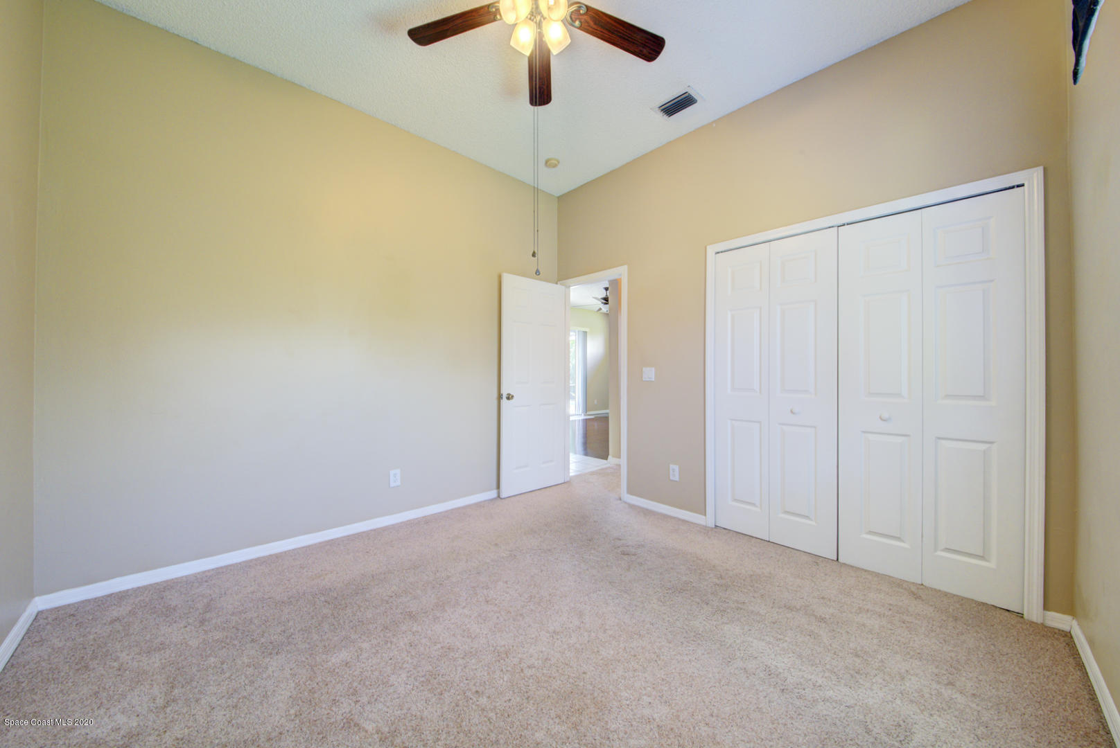 581 Raleigh Road Southeast Palm Bay, FL 32909 - Photo 59 of 60 bedroom 3 with carpet