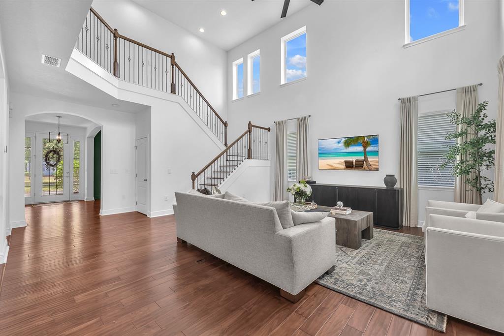 5310 Fishhawk Ridge Drive Lithia, FL 33547 - Photo 8 of 52 a living room with furniture and a wooden floor