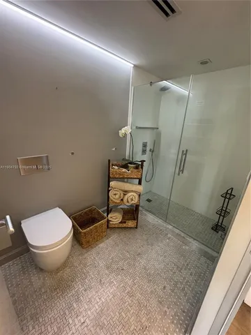 a view of a dry yard with wooden floor and fence