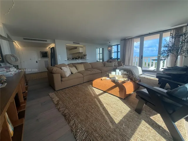 a view of a dining room with furniture and window