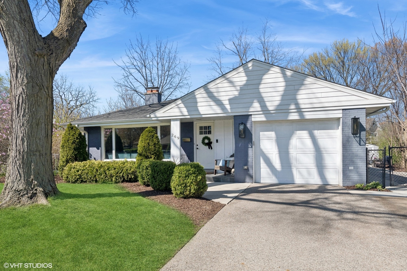 a front view of a house with garden