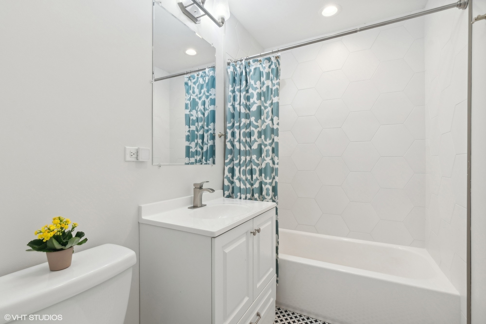 269 Riverside Drive Northfield, IL 60093 - Photo 18 of 28 a bathroom with a sink a toilet and shower