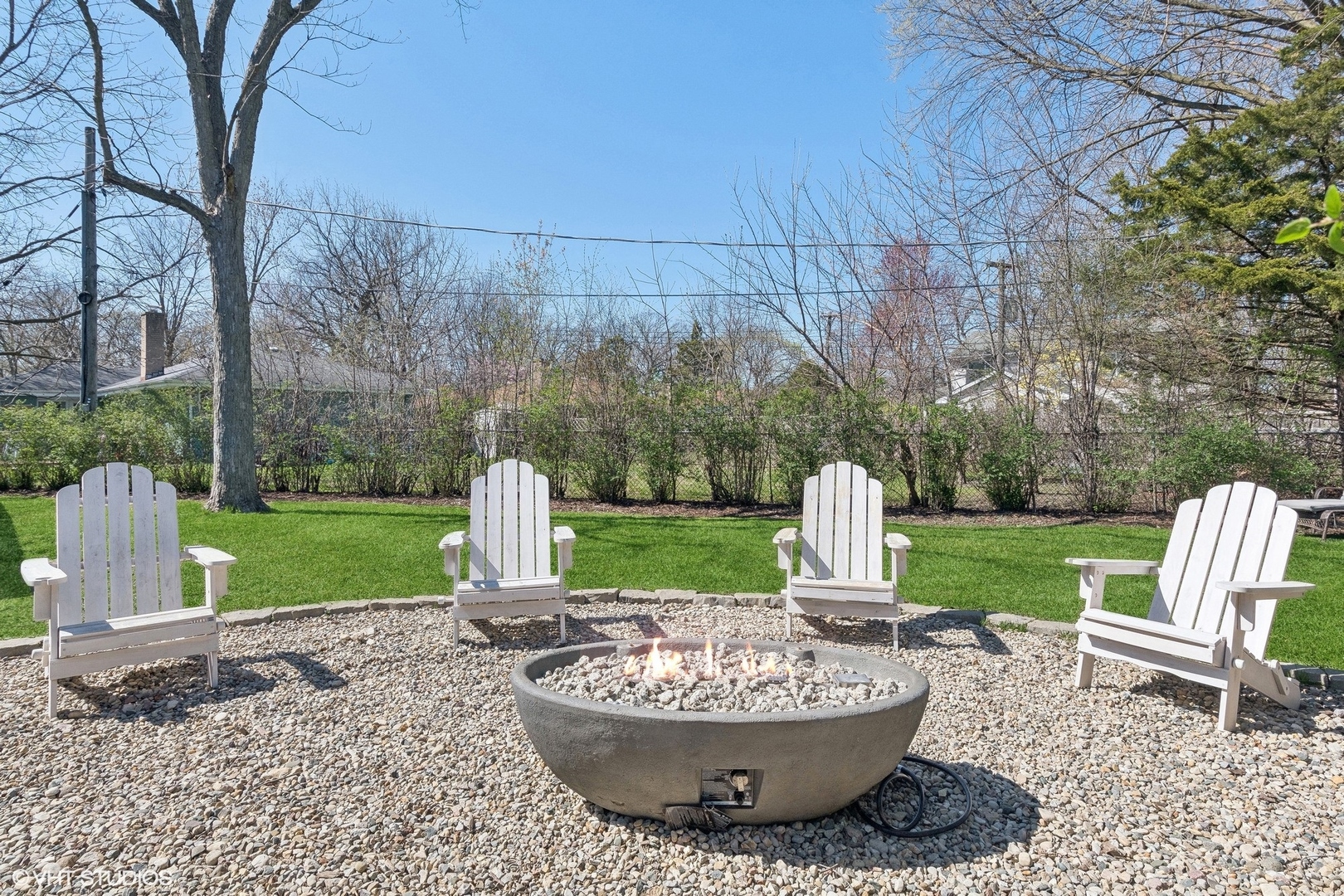 269 Riverside Drive Northfield, IL 60093 - Photo 24 of 28 a view of a table and chairs in the garden