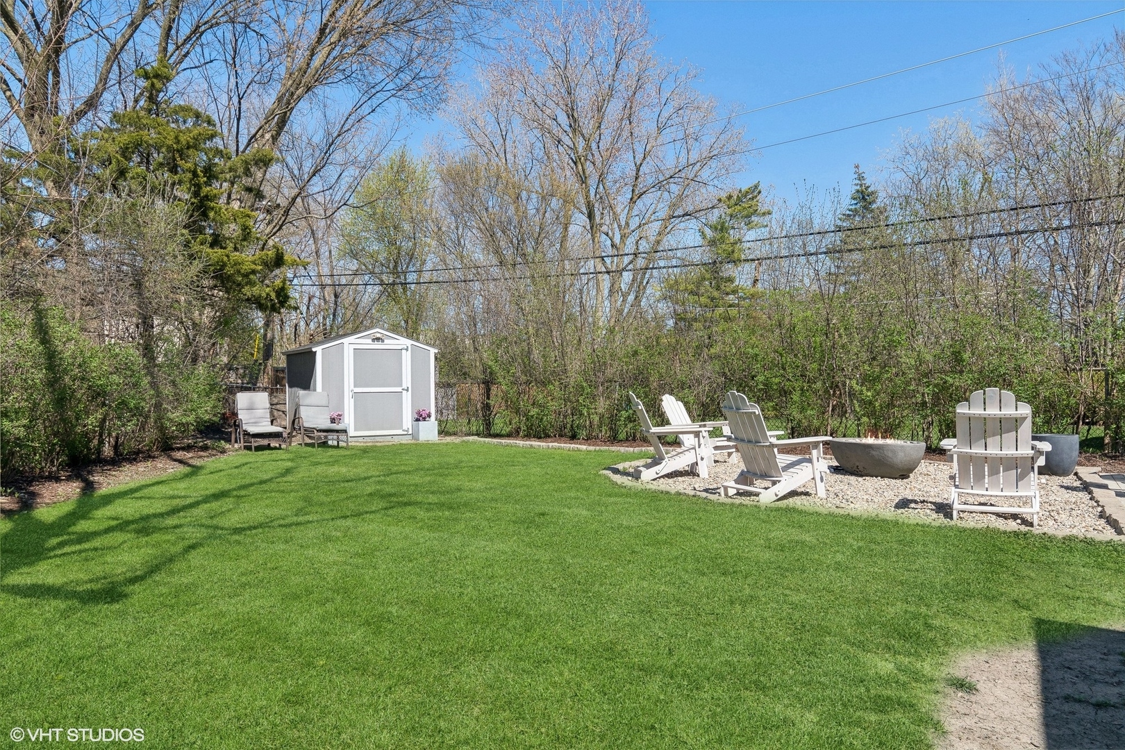 269 Riverside Drive Northfield, IL 60093 - Photo 25 of 28 a view of a chair and table in the garden