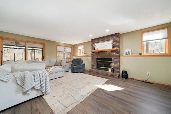 a living room with furniture flat screen tv and a fireplace
