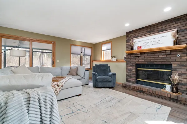 a living room with furniture and a fireplace