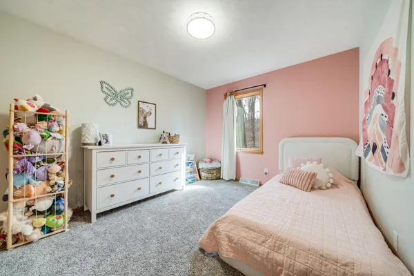 a bedroom with a bed and a cabinets