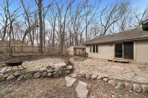 a backyard of a house with large trees