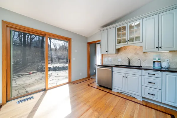 a kitchen with granite countertop a stove a sink and a granite counter tops