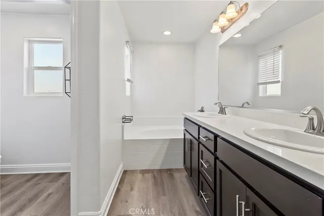 a bathroom with a sink a vanity and a mirror