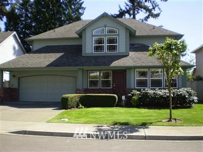2021 Northeast 28th Place Renton, WA 98056 - Photo 1 of 1 a front view of a house with a garden