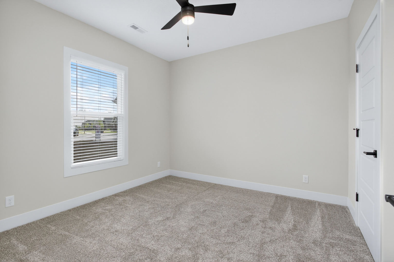 412 North 2nd Street Eldridge, IA 52748 - Photo 4 of 30 a view of a livingroom with a ceiling fan & a window