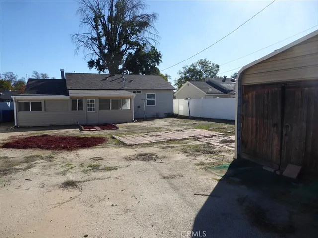 a view of a house with a snow in the yard