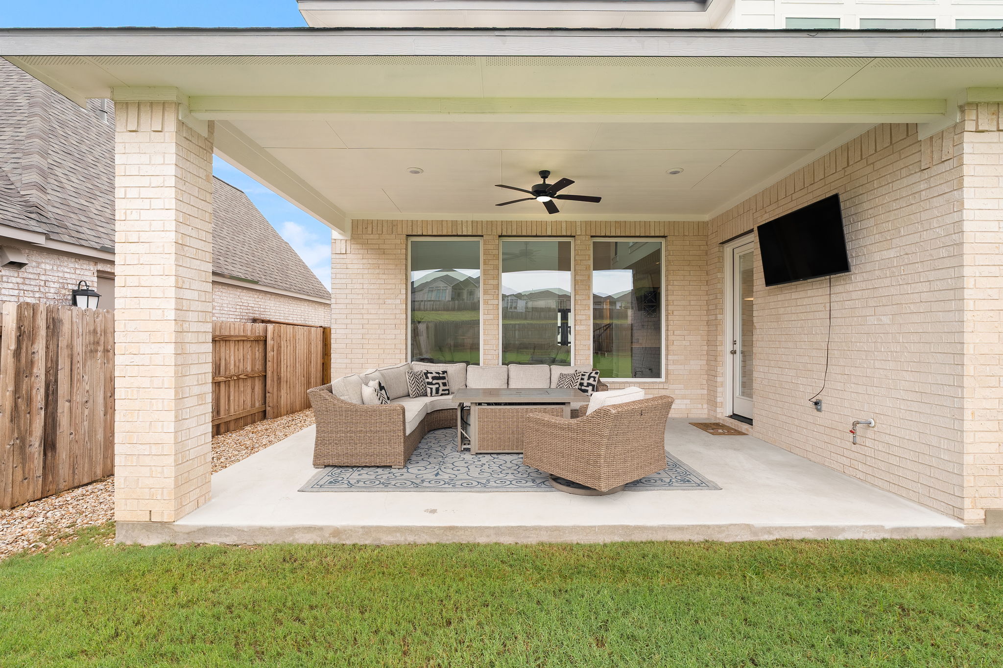 515 Watershield Cove Georgetown, TX 78633 - Photo 36 of 40 An inviting covered patio, perfect for enjoying outdoor moments, features a ceiling fan and ample space for entertaining.