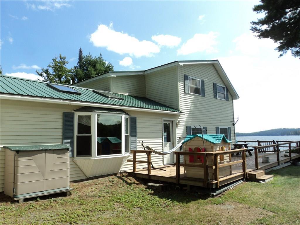 12 Howard Point Road Brownville, ME 04414 - Photo 5 of 18 Right side of home looking to lake....