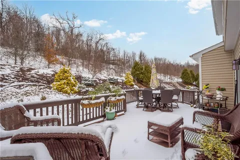 a view of a chairs and tables in the balcony